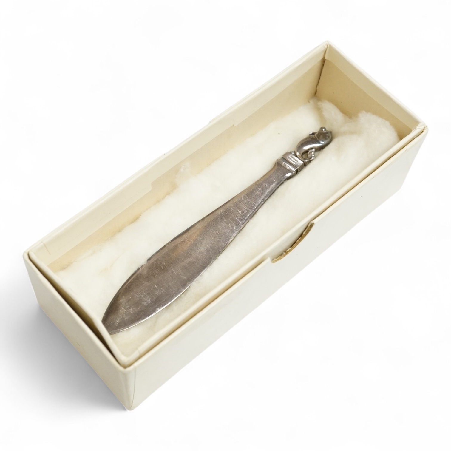 A 1960's Georg Jensen silver paperknife, design no.198, 11.5cm, with dolphin finial.